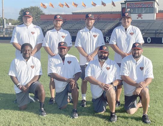 SHORTHORN COACHING STAFF: Kneeling, from left: Jaylen Samuels, Brandon Williams, Isaiah Barrera, and Cameron Besetzny. Standing, from left: Brad Oden, Jordan Hafley, head coach Luke Hobbs, and Marty Bigham. Sticker Photo By Darrell Vyvjala