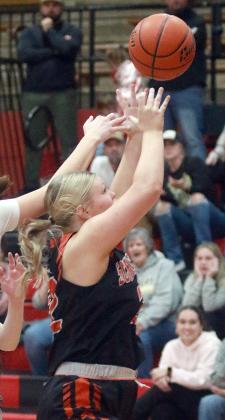 Ava Bubela pulls down an offensive rebound in the second quarter. Sticker Photo By Darrell Vyvjala