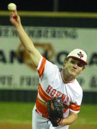 Brycen Schramek delivers a strike-out pitch last Tuesday. Sticker Photo By Darrell Vyvjala