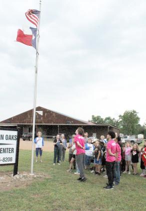 The Pledge of Allegiance was led by Boys &amp; Girls Club members to conclude the program at which the club was recognized for displaying the U.S. flag.