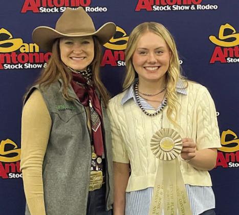 10th high po int individual Keeley Warnken (right) is shown with a San Antonio judging contest representative.