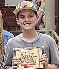 KIDS’ COOKOFF – Noah Faith (at right) of Mars BBQ, Schulenburg - first place pork steak (7- to 12-year-old division). Sticker Photo By Layne Vyvjala