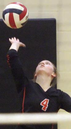 Avery Helms sends a serve on it way in game three. Sticker Photo By Darrell Vyvjala