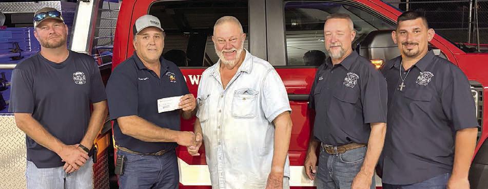 A donation for “Make A Difference Day” was presented to the Schulenburg Volunteer Fire Department by the Schulenburg Hermann Sons Life lodge. Shown are (from left) SVFD first assistant chief Drew Brossmann, Fire Chief Darren Guentert, lodge president resident Ed Moeller, SVFD second assistant chief Randy WIck and SVFD third assistant chief Gary Eudy.