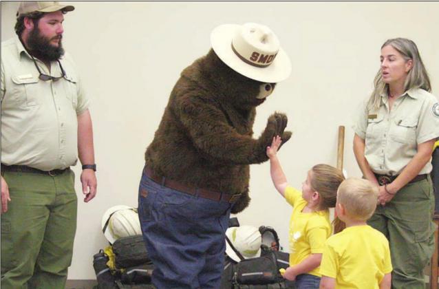 Smokey Bear visits library