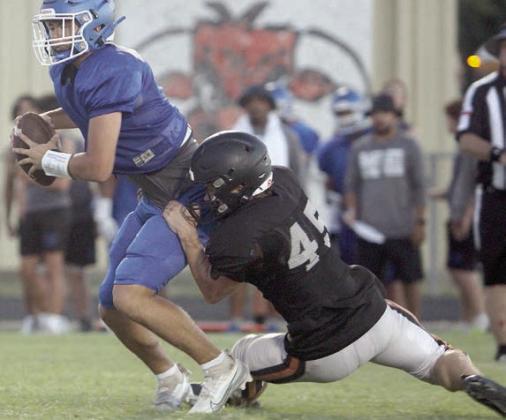 Jacob Vacek helps stop a Bartlett drive with a quarterback sack on third and goal. Sticker Photo By Darrell Vyvjala