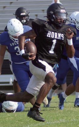 Da’Terrion Houston sprints away from defenders for a 39-yard touchdown run last Thursday. For more on the three-way scrimmage with Bartlett and Shiner St. Paul, see SPORTS. Sticker Photo By Darrell Vyvjala
