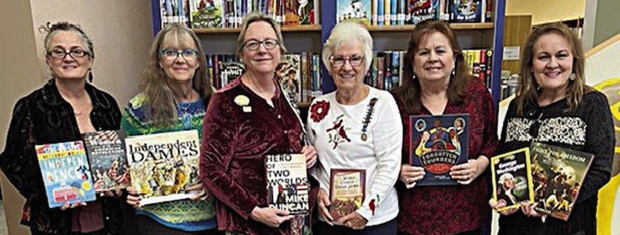 Donation to Schule nburg Publ ic Library – (from left) Juli McCroskey, DAR member; Cindy Lytle, Schulenburg Public Library staff; Kim Joost, Smith-McMillan Chapter librarian; Carolyn Caflisch, Smith-McMillan Chapter regent; Donna Holub, Schulenburg Public Library staff; and Lori Schultz, DAR member.