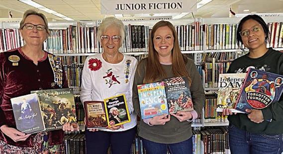 Donation to Fayette Publ ic Library – (from left) Kim Joost, Smith-McMillan Chapter librarian; Carolyn Caflisch, Smith-McMillan Chapter regent; Allison MacKenzie Hollek, Fayette Public Library (La Grange) director; and Carol Perales, Fayette Public Library youth services coordinator,