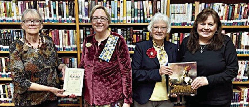 Presentation at Schulenburg Public Library – (from left) Cindy Lytle, Schulenburg Public Library staff; Kim Joost, Smith-McMillan Chapter librarian; Carolyn Caflisch, Smith-McMillan Chapter regent; and Donna Holub, Schulenburg Public Library staff.