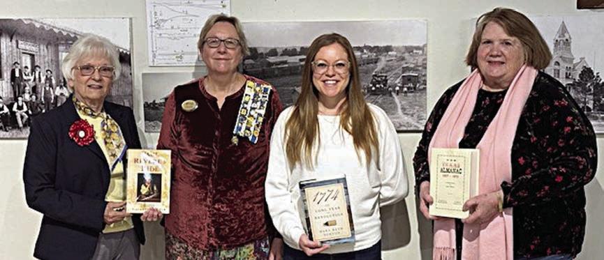 Presentation at Fayette Public Library/ Fayette Heritage Museum &amp;amp;Archives – (from left) Carolyn Caflisch, Smith-McMillan Chapter regent; Kim Joost, Smith-McMillan Chapter librarian; Allison MacKenzie Hollek, Fayette Public Library (La Grange) director; and Rox Ann Johnson, Fayette Heritage Museum &amp;amp; Archives archivist.