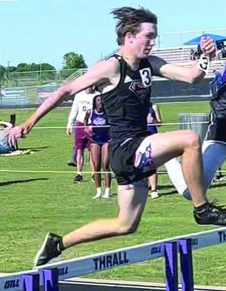 Nick Goode clears a hurdle in the 300-meter event on his way to a fifth-place finish. Also competing at the area meet for the Shorthorns were Rodney H Walton, in the triple jump, and Alton Herzik, in the 3200-meter run.