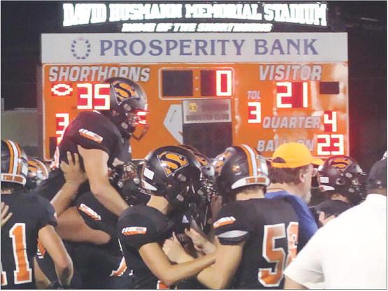 Shorthorn players congratulate each other following last Friday’s 35-21 win to end a losing streak that reached 13 games. Sticker Photo By Layne Vyvjala