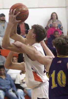 Van Prihoda gets fouled by a Wildcat on a shot in the second quarter. Sticker Photo By Darrell Vyvjala