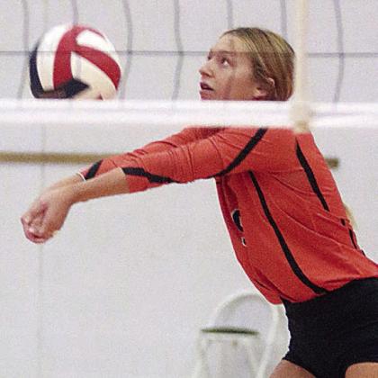 Michaela Kollmann picks up a dig in the Lady Horns’ second pool-play match of the Columbus tournament. Sticker Photo By Darrell Vyvjala