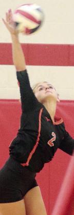 Miranda Bonner serves an ace in the second set against Victoria West on Thursday. Sticker Photo By Darrell Vyvjala
