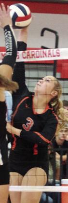 Reagan Dusek sends a kill over the net in the first set versus Victoria West on Aug. 14. Sticker Photo By Darrell Vyvjala