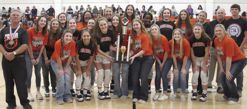 The Lady Horns, managers, and coaches, pose with the Chevy Spotlight Award trophy along with one of their biggest fans, Pauler.