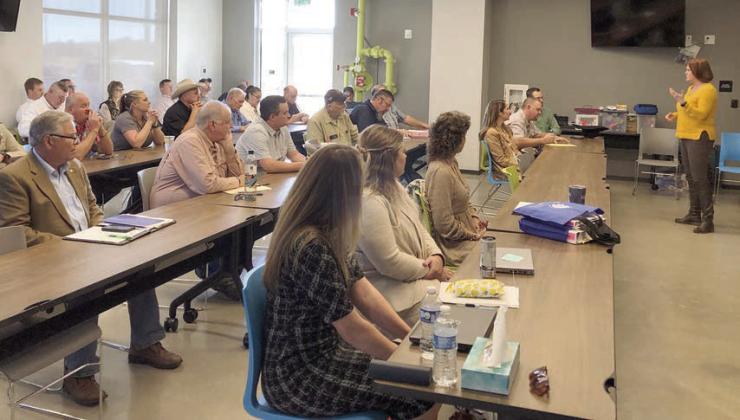 Newly-appointed Emergency Management Coordinator Angela Hahn addresses the group of officials and community leaders who attended a meeting on the County’s mitigation plans last week.