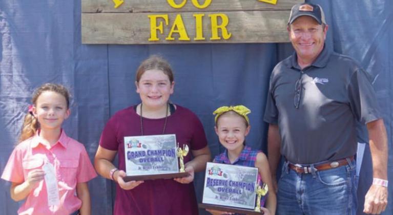 Junior Overall High Point – (from left) Tatum Fritsch, 3rd; Rheagan Karisch, grand champion high point overall; and Lillian Carey, reserve champion high point overall. Sponsor: Capital Farm Credit, represented by Tim Knesek (right).