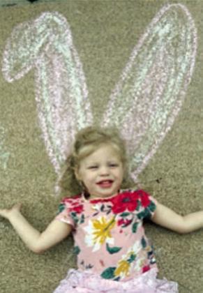 A little girl got bunny ears via the chalk art.