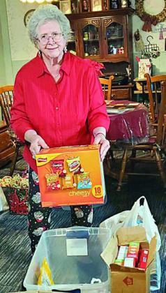 Project Patriot and Service to Veterans Chair Jo Ann Vasina at her home in East Bernard with donations for USO Houston from members of the Smith-McMillan Chapter of the Daughters of the American Revolution.