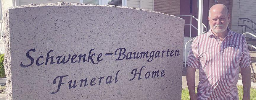 Mark Klesel poses outside the funeral home last Thursday. Sticker Photo By Darrell Vyvjala