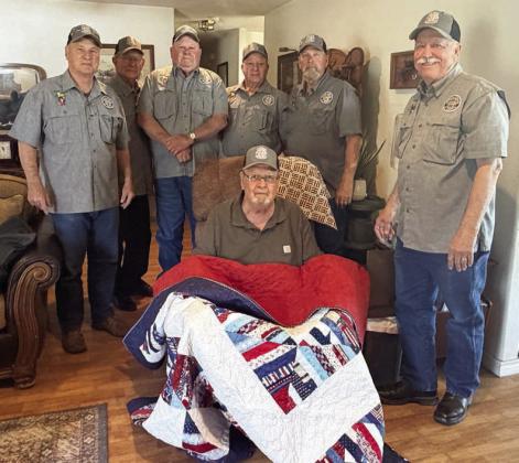 John Dodson (front), Vietnam veteran who served in the U.S. Army, was recently presented a Quilt of Valor by Vietnam Veterans of America Chapter 870. Dodson was not only a founding member and original officer of VVA Chapter 870 but is also a retired teacher in Schulenburg. Delivering the quilt to Dodson were VVA 870 members (back row, from left) Don Christen, Eugene Krupala, Daniel Kutac, Frank White, Gerald Smith and Andy Janda.