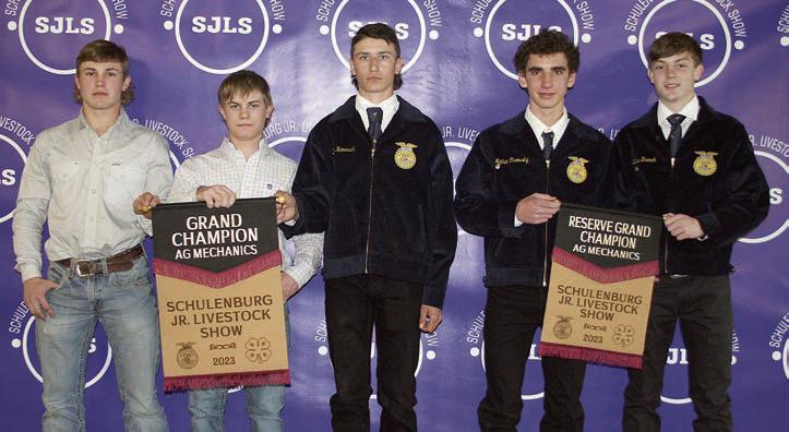 AG MECHANICS SHOW – From left: Jacob Vacek, John Vacek, and Zach Hammack, grand champion (30-foot flatbed trailer); and Nathan Olsovsky and Zane Brenek, reserve champion (12-foot utility trailer). Sticker Photo By Darrell Vyvjala