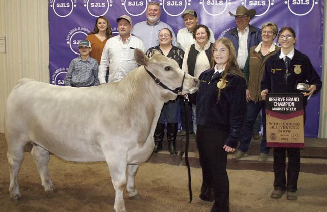 RESERVE CHAMPION MARKET STEER – Exhibitor: Kyrroll Prihoda (front). Sales price: $9,000. Sticker Photo By Darrell Vyvjala
