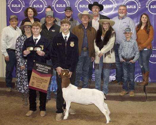 RESERVE CHAMPION MARKET GOAT – Exhibitor: Van Prihoda (front, right). Sales price: $5,400. Sticker Photo By Darrell Vyvjala