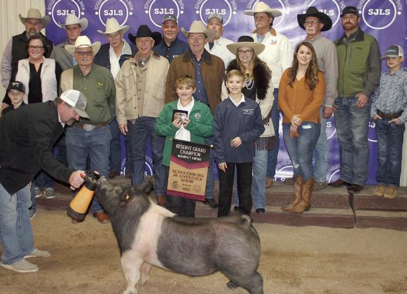 RESERVE CHAMPION MARKET SWINE – Exhibitor: Gatlin Matura (front, right). Sales price: $5,000. Sticker Photo By Darrell Vyvjala