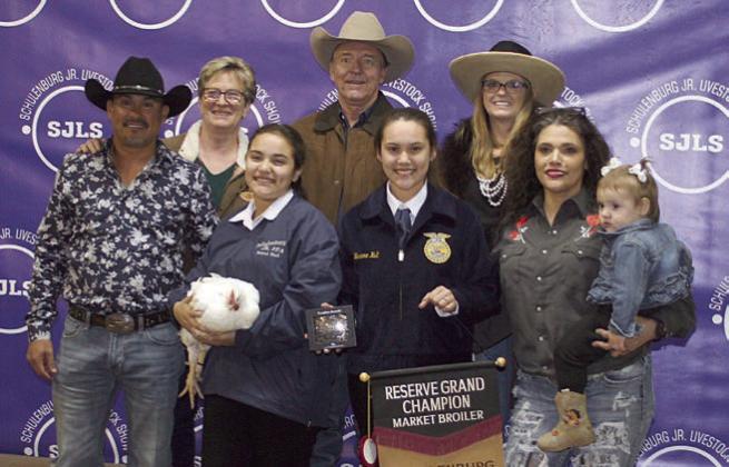 RESERVE CHAMPION MARKET BROILERS Exhibitor: Bristol Hull (front, second from right). Sales price: $4,920. Sticker Photo By Darrell Vyvjala