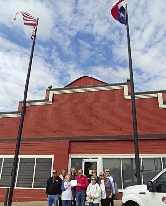 DAR recognizes leon's Electric &amp; Plumbing for flag display