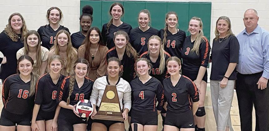 Shown with their Class 2A Region IV championship trophy are: (front, from left) Kelly Netro, Clara Magliolo, Keaton Walker, Kieryn Adams, Avery Helms, Madison Kunschick; (second row, from left) manager Haylee Vacek, manager Michaela Kollmann, manager Perla Martinez, Landry Zapalac, Angel Davis; (back, from left) assistant coach Allison Machac, Grace Schramek, Jessalyn Gipson, Meredith Magliolo, Brooke Redding, Emmrie Marx, Reagan Dusek, assistant coach Melissa Zapalac, and head coach Donald Zapalac.