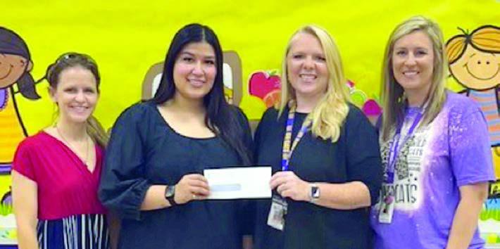 LEFT photo Presentationat St. Michael’s Sc hool – (from left) Kari Tumis, Julius Castillo, Sherry Pietsch, Melanie Ramirezrepresenting Stanzel Family Foundation, Cheryl Pekar--representing Stanzel Family Foundation and (not shown) Ann Barlow. right photo Presentation at Weimar Elementary – (from left) Cheryl Pekarrepresenting Stanzel Family Foundation, Melanie Ramirez-representing Stanzel Family Foundation, Kristy Janecka and Cheyenne Bouse.