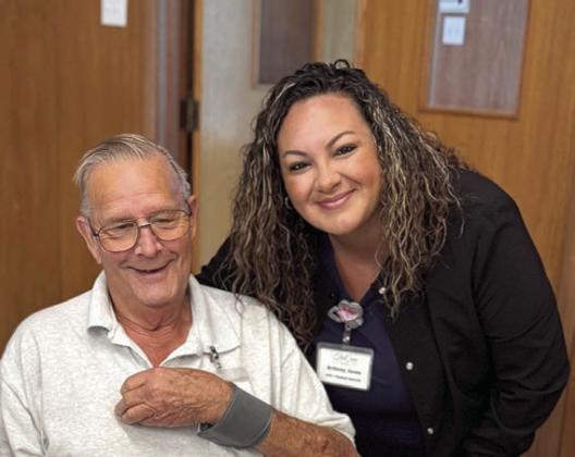 Blood Pressure Checks – Brittney Jones (right) of True Care Living came to the Weimar program at First United Methodist Church to do blood pressure checks on Tuesday morning, July 15. While performing this service, Jones quietly made her way around the room, not disturbing the domino games being played!