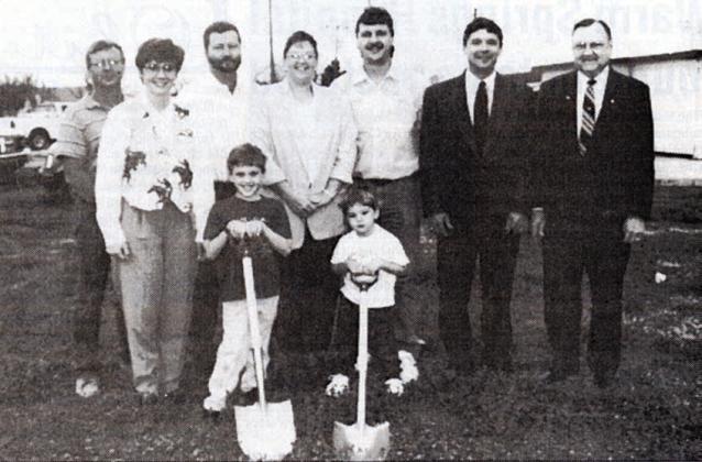 In 1997, the Lebedas (back, third and fourth from right) broke ground at its current location with sons Austin and Logan handling the shovels. Also shown are City of Schulenburg and bank representatives as well as the contractor.