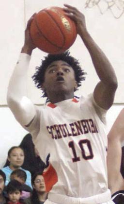 Da’Terrion Houston catches a lob pass at the basket to score at the start of the second quarter against Flatonia. Sticker Photo By Darrell Vyvjala