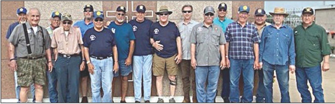 MEMBERS OF American Legion Post 143, Sons of the American Legion, Legion Riders and Vietnam Veterans Chapter 870 gathered on Monday, May 20 to place flags on the graves of deceased veterans. A group of these veterans is shown in front of the mausoleum at the St. Rose of Lima Catholic Cemetery.