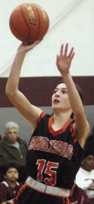 Ava Faith scores on a second-half drive in the Lady Horns’ season finale. Sticker Photo By Darrell Vyvjala