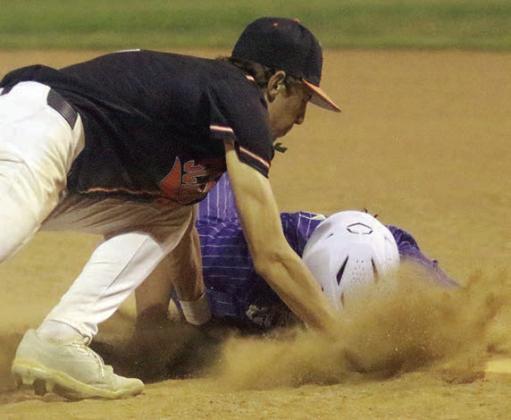 First baseman Van Prihoda tags out a Hornet after receiving a throw from catcher Jayse Janda for a pickoff in the top of the fifth inning. Sticker Photo By Darrell Vyvjala