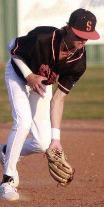 Third baseman Connor Lichnovsky scoops up a grounder for the first out against Louise. Sticker Photo By Darrell Vyvjala