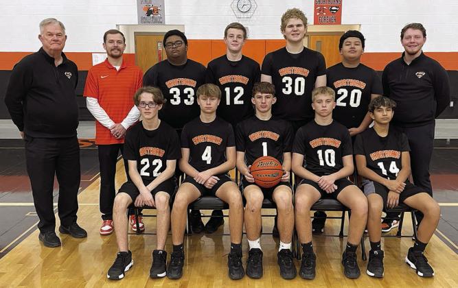Seated, from left: Jonah Bartek, Brett Hollas, William Eudy, Weston Hollas, and Rilee Kusy. Standing, from left: head coach Richard Hoogendoorn, assistant coach Jordan Hafley, Albert Wright, Bo Brossmann, Colton Matura, Rafael Rico, and assistant coach Aaron Rowlett. Sticker Photo By Darrell Vyvjala
