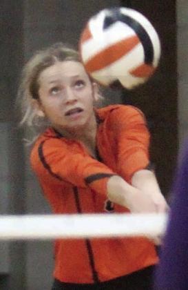 Michaela Kollmann digs a Shiner attack in the first set. Sticker Photo By Darrell Vyvjala