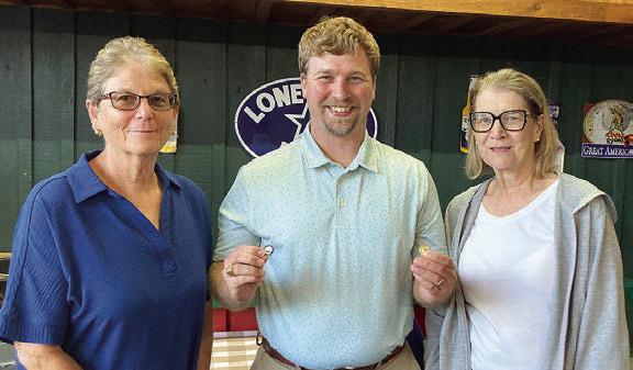 Year pins were presented to Mary Krupala (left), 60-year pin, and. Mary K. Seifert (right),70-year pin, by agent Kyle Hartmann (center).
