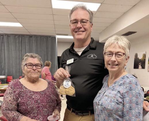 Speaker – Shon Horan (center), director of Schulenburg Family Fitness &amp;amp; Rehabilitation Center, explains exercises that can be done to improve bone strength and how to ward off lymphedema (a condition that causes swelling in the body’s tissues) with lymph drainage exercises. He is shown with Carolyn Moore and Peggy Hiatt.