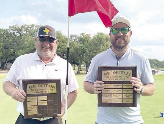 Putting Contest Champs - From left: Kenny Helmcamp, first place; and Travis Vanicek, second place.
