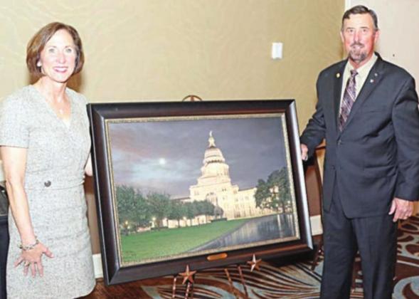 State Sen. Lois Kolkhorst (left) was presented the S.M. True Agricultural Champion Award by Texas Farm Bureau AGFUND president Russell Boening (right).