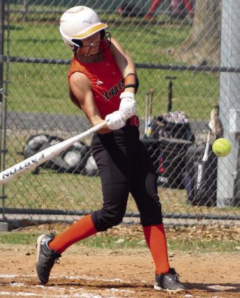 Mikayla Stang puts a home-run swing on a pitch in the bottom of the second inning against Snook. Sticker Photo By Darrell Vyvjala